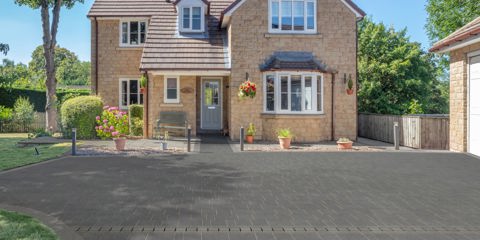 Marshalls Lunar paving in a silver dust colour laid on the driveway of a modern house