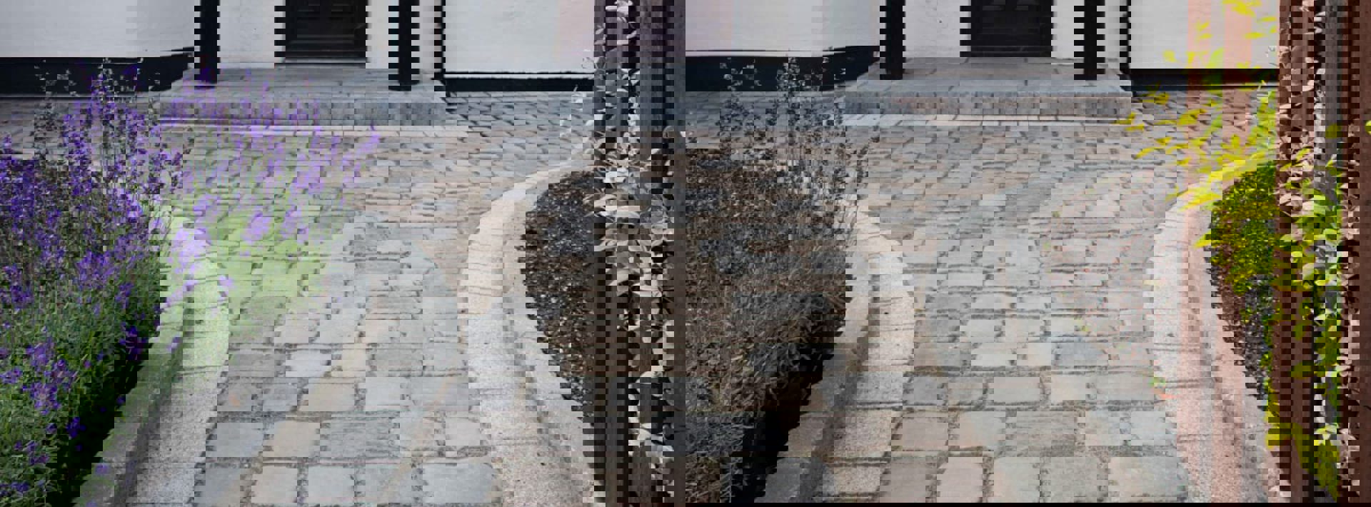 Marshalls Drivesys Cobble in iron grey and canvas laid on a pathway leading up to a house