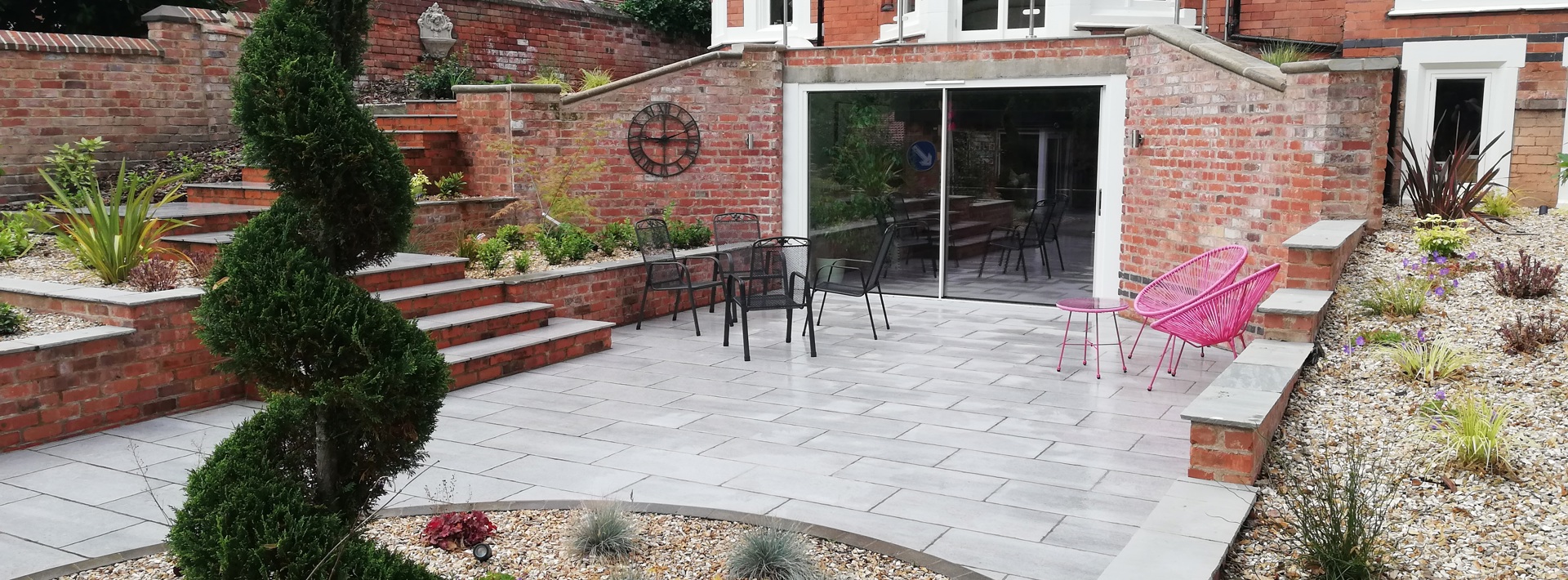 Sloped garden and driveway design ideas Hero Image