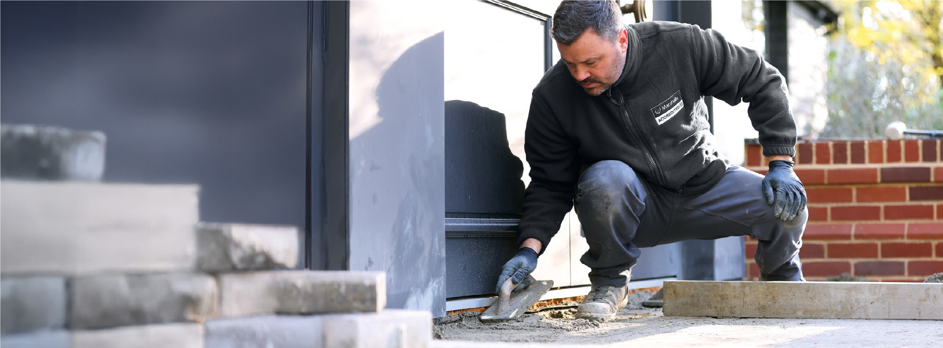 An accredited member laying a driveway