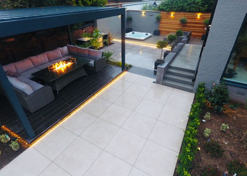 SYMPHONY® Urban in Clay A grey awning over patio seating and a firepit
