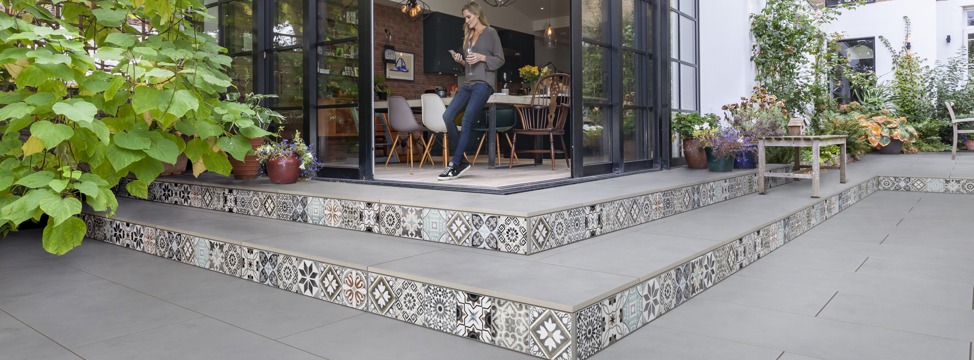 Marshalls Symphony Matte carbon and deco laid in a garden and along the garden steps