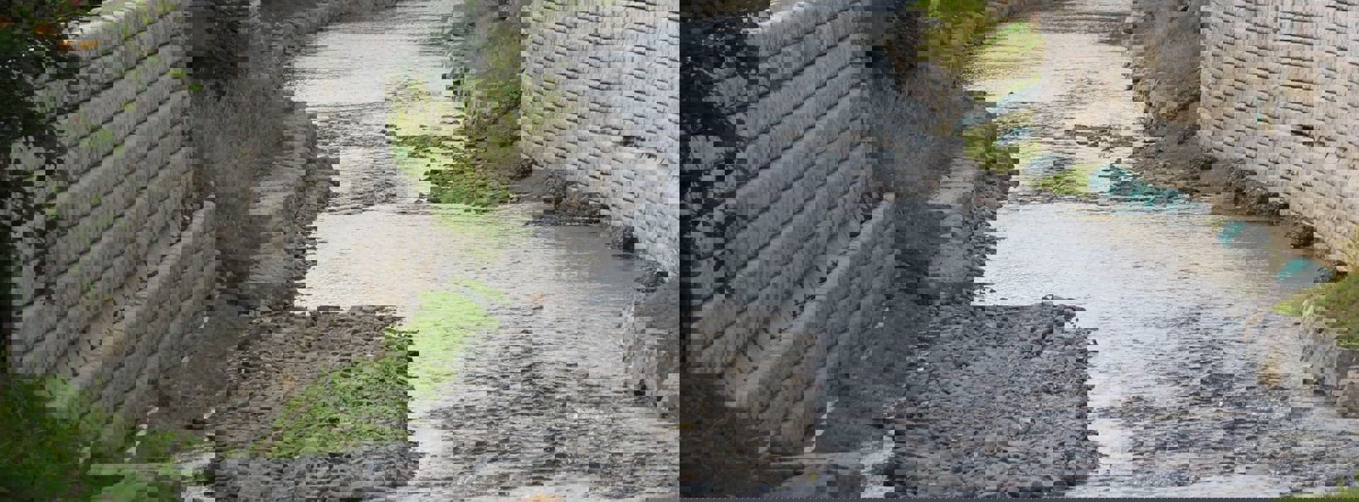 Flood protection walling next to a stream
